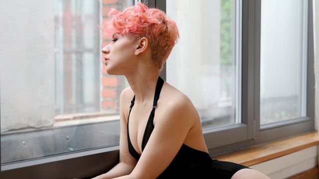 Good-looking teen with pink hairs Vicky Addams rides on a dick