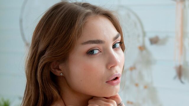 Pretty cute brunette Kate K. demonstrates her small tits and pussy