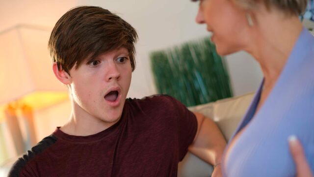 Lusty blonde MILF Dee Williams fucks with a young man on the sofa