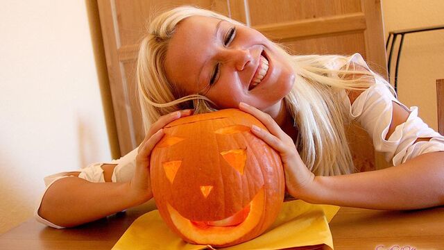 Smiling cutie blonde Sophie Moone knows how to make a pumpkin
