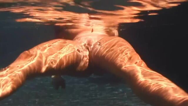 Naked BBW lady Cherry Brady exposes her natural tits underwater