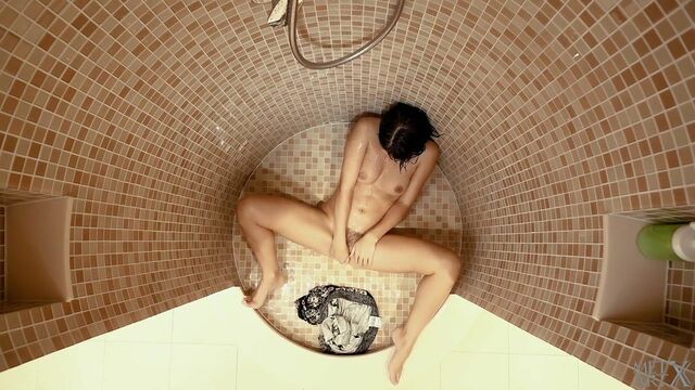 Great-looking slender brunette Jasmine Jazz is having fun in solo style