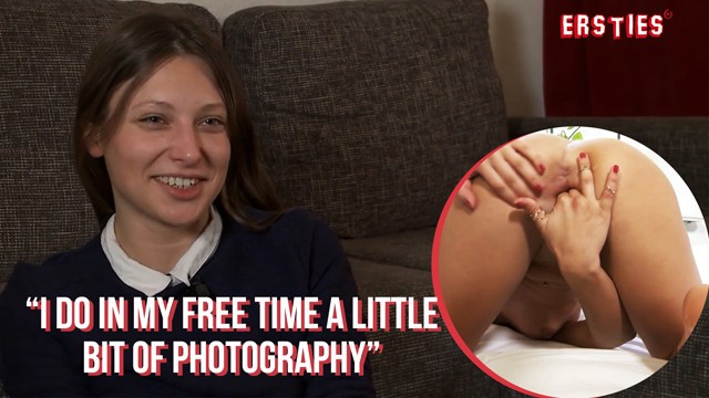 Talia spreads on bed by black metal headboard