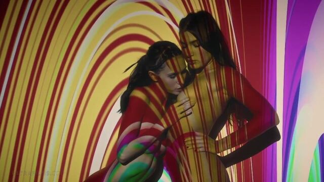 Ellie Luna smiles as stripes of colored light cross her