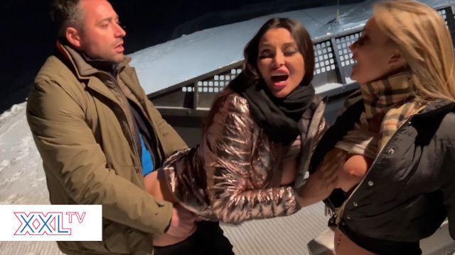 After Dark on the Ski Slope, Two Busty Women Share One Lucky Skier