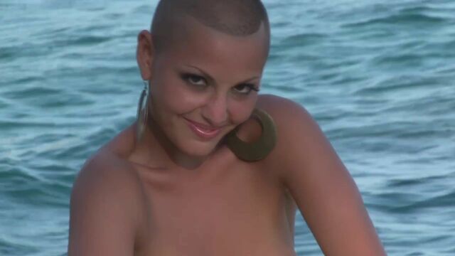 Flexible long-legged angel demonstrates her naked goods outdoors