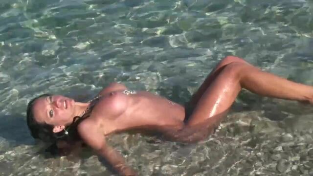 Outdoor nudity in the ocean with a gorgeous naked brunette