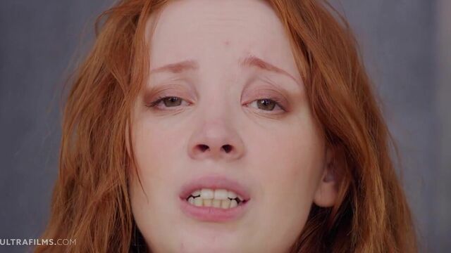 Beautiful redhead chick Lottie Magne plays with her pink pussy